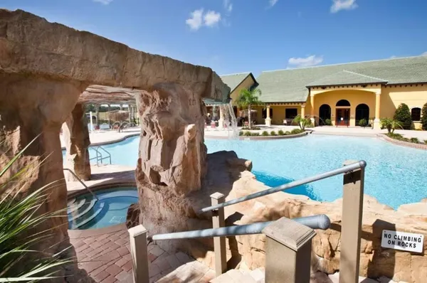 a view of a house with swimming pool