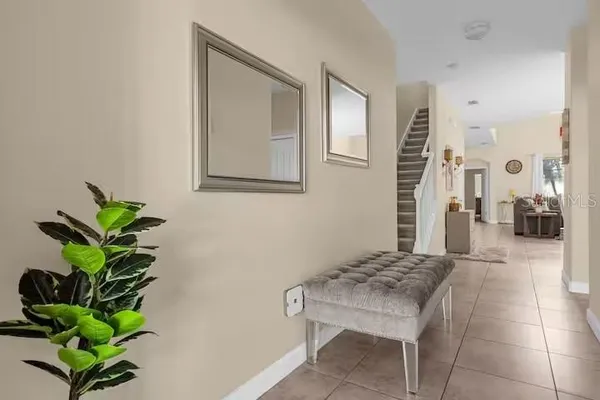 a living room with a potted plant