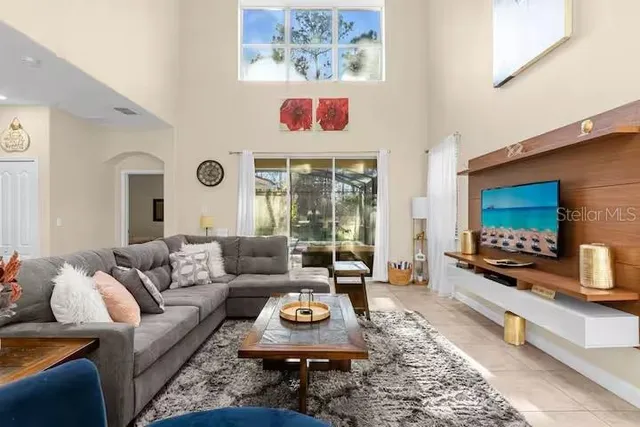 a living room with furniture and a flat screen tv