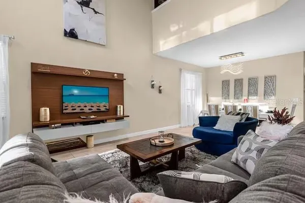 a living room with furniture and a flat screen tv
