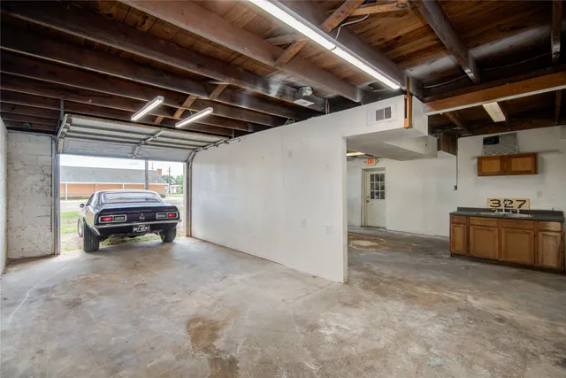 a view of empty room with wooden ceiling