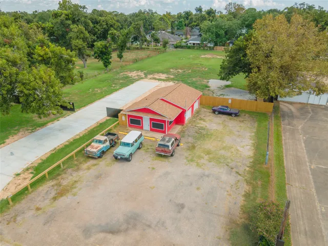 an aerial view of a houses with outdoor space and street view