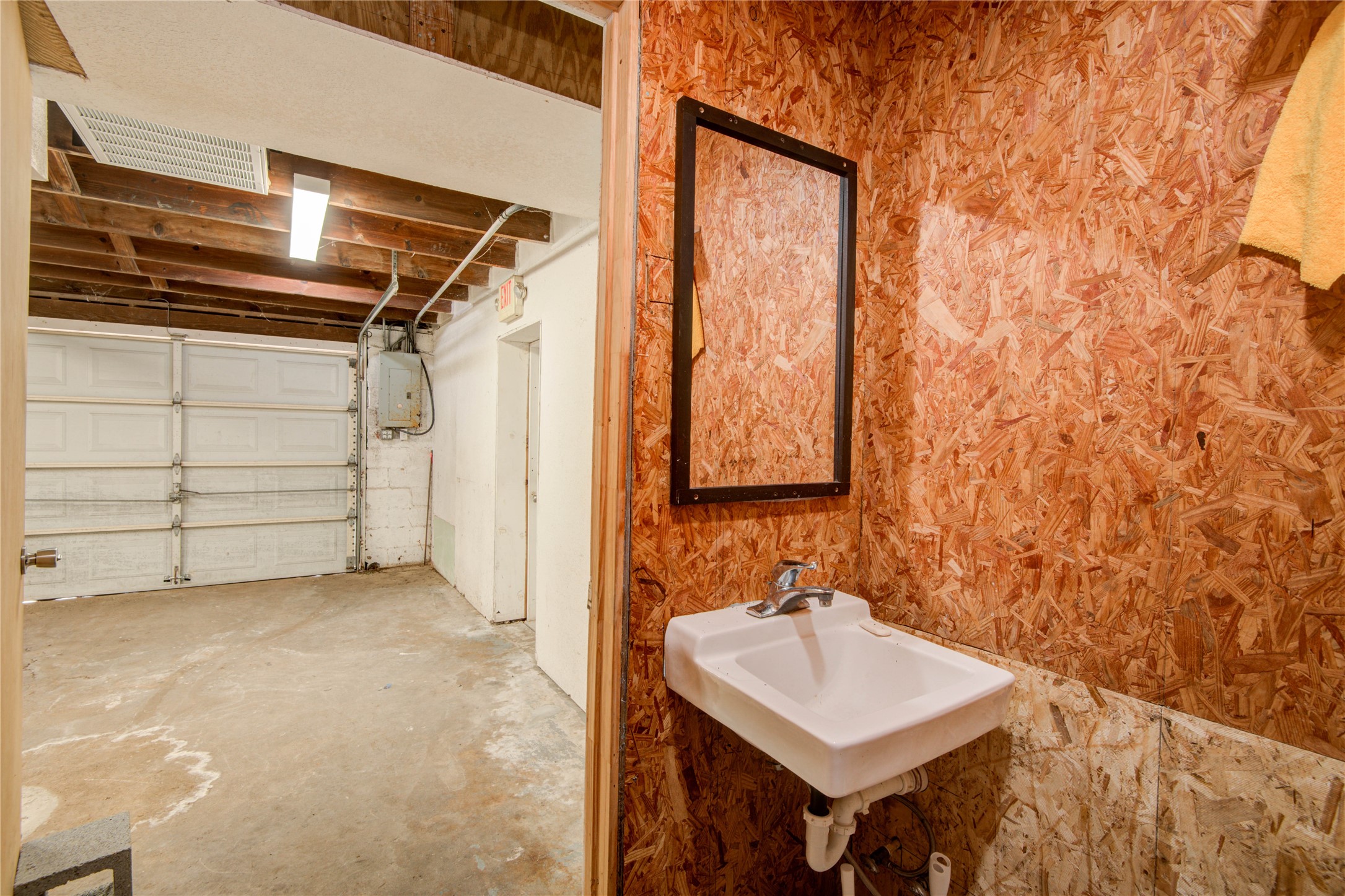 327 South Main Street Clute, TX 77531 - Photo 21 of 31 a bathroom with a sink and a mirror