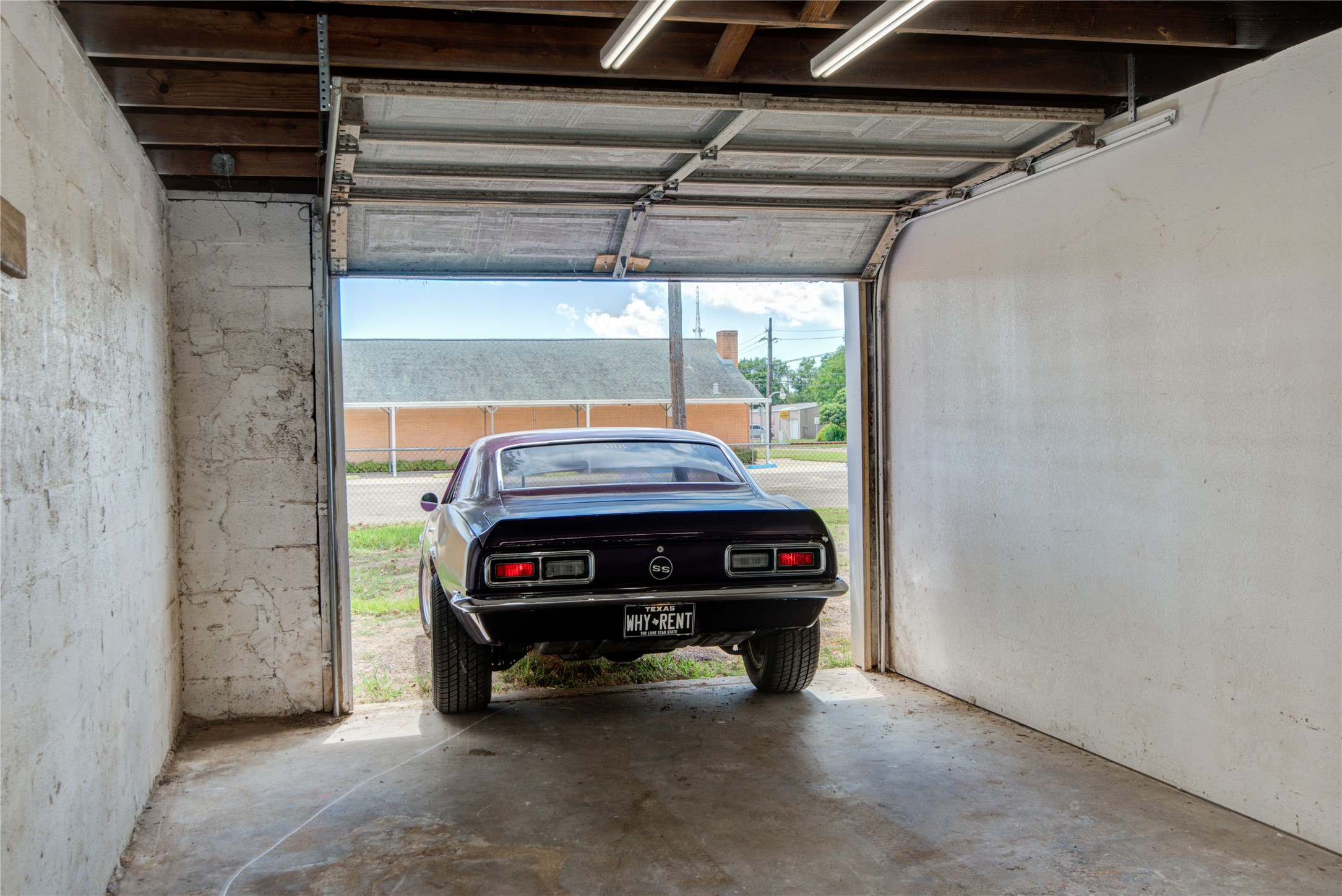 327 South Main Street Clute, TX 77531 - Photo 26 of 31 a car parked in a garage