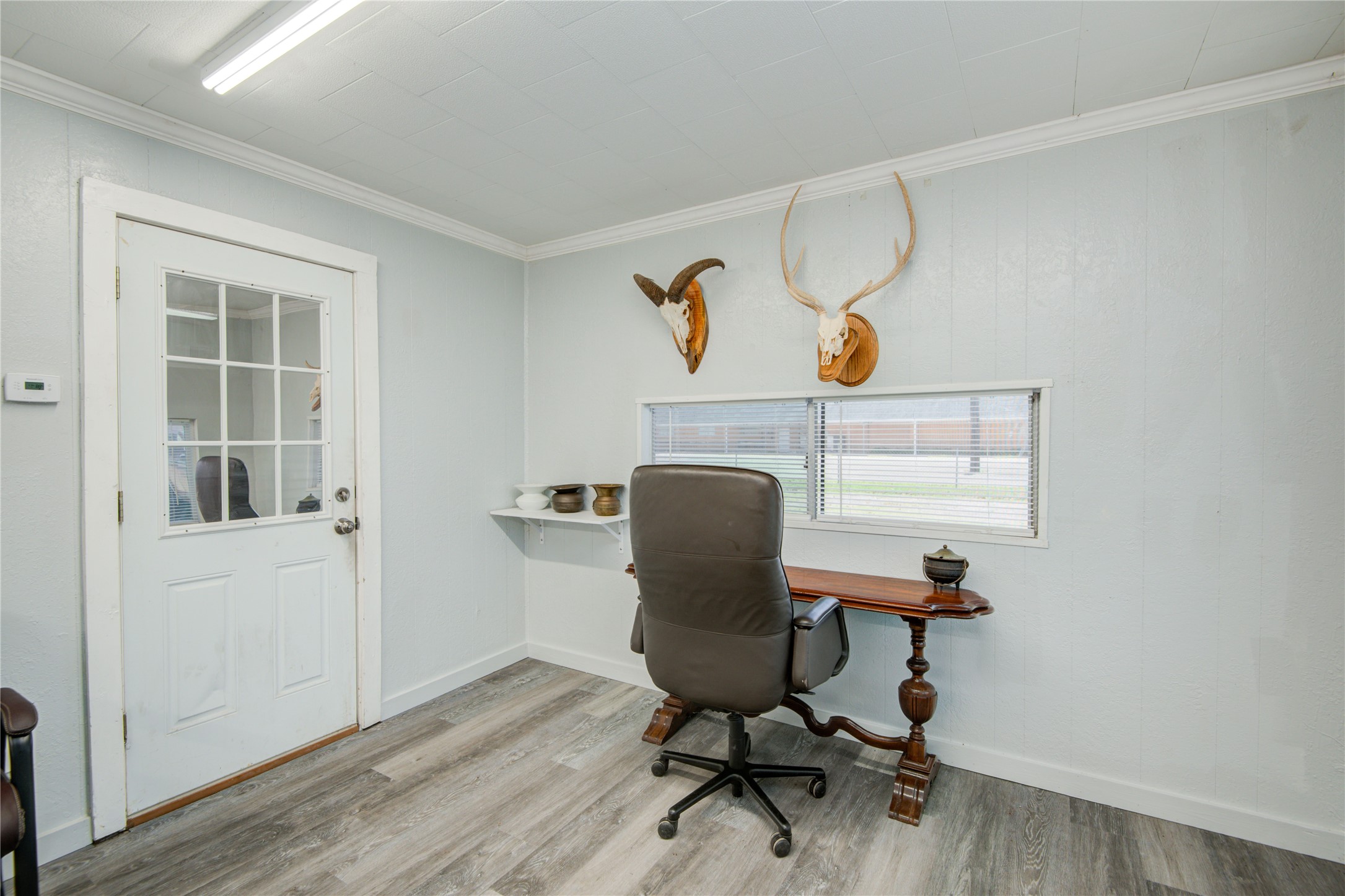 327 South Main Street Clute, TX 77531 - Photo 27 of 31 a view of a workspace with furniture and a window