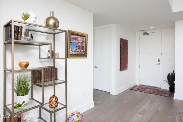 a bathroom with a sink vanity mirror and toilet