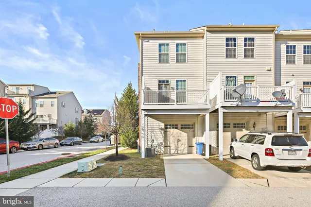 a view of a building with car parked