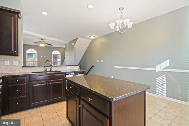 a kitchen with a sink and stove