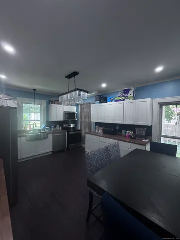 a living room with furniture rug and window