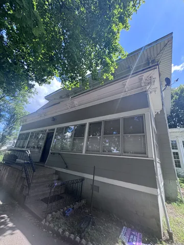 a view of a bench in the backyard