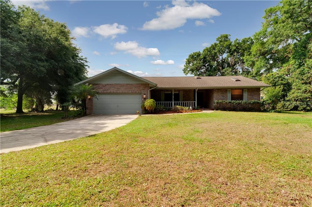 13019 Sydney Road Dover, FL 33527 - Photo 1 of 1 a view of a house with a swimming pool
