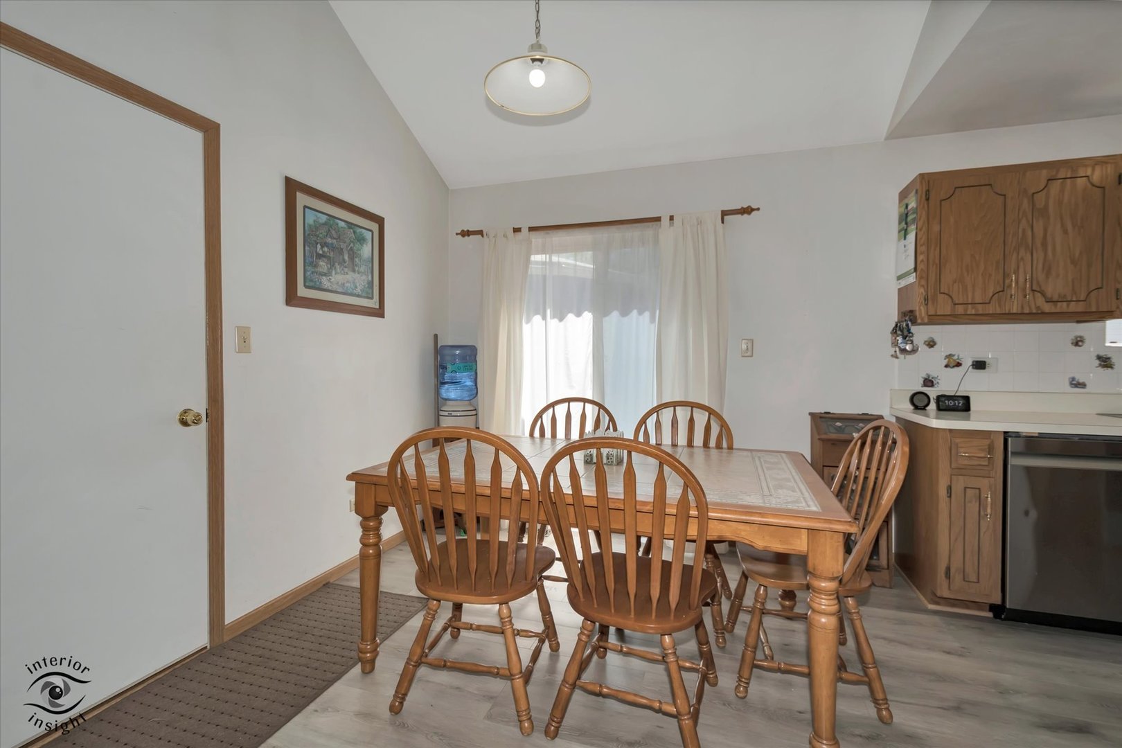 930 Meadowbrook Road Elwood, IL 60421 - Photo 7 of 25 a view of a dining room with furniture and wooden floor