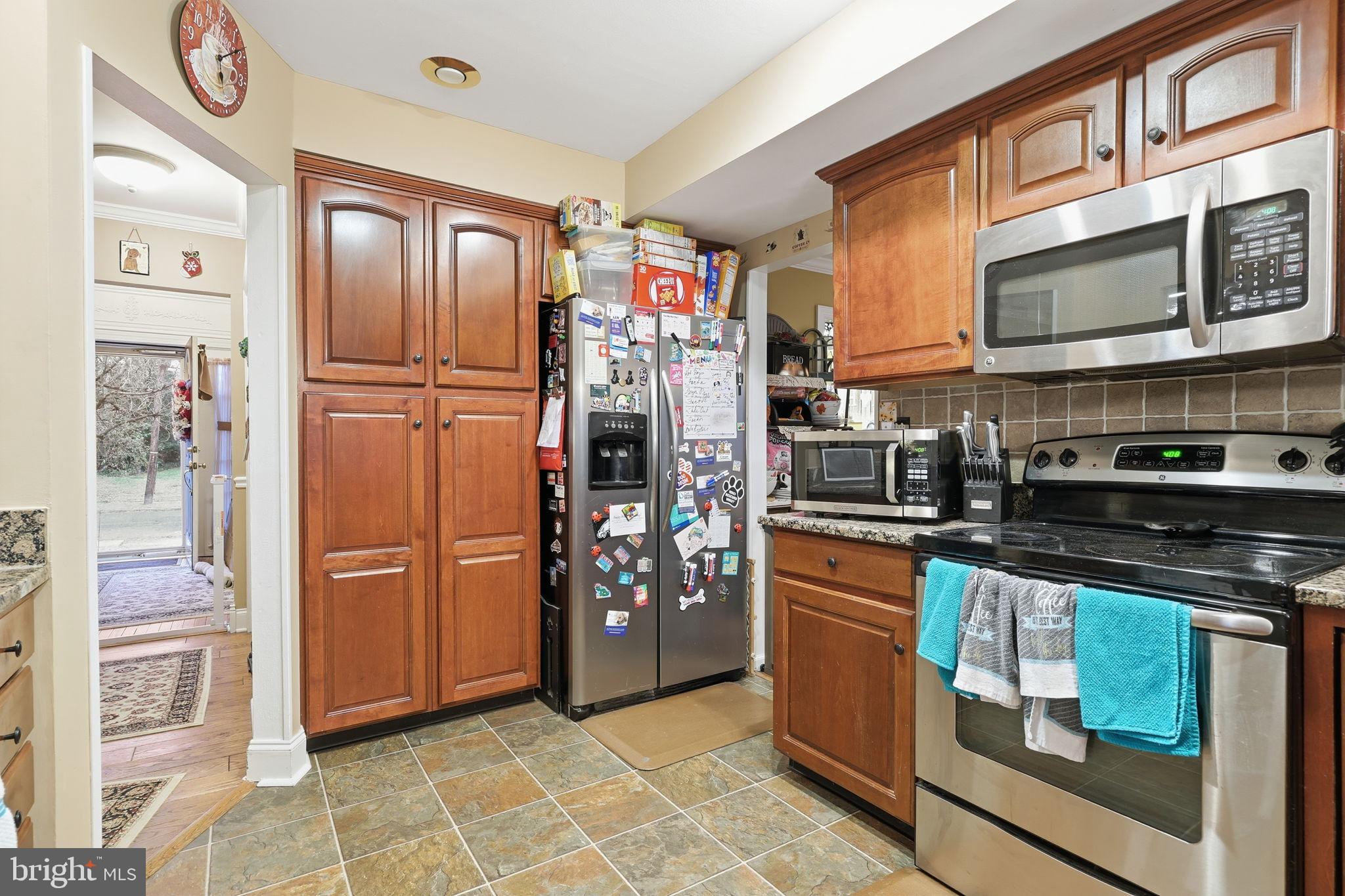 103 Greenvale Road Cherry Hill, NJ 08034 - Photo 12 of 36 a kitchen with stainless steel appliances granite countertop a refrigerator and a stove