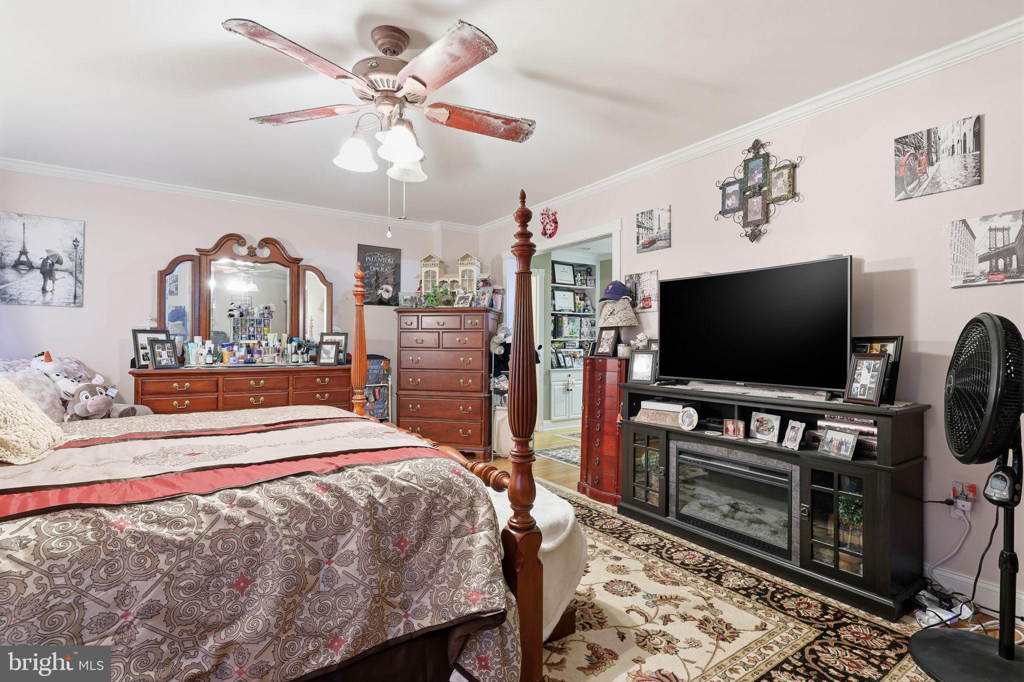 103 Greenvale Road Cherry Hill, NJ 08034 - Photo 23 of 36 a bedroom with a bed and a flat screen tv
