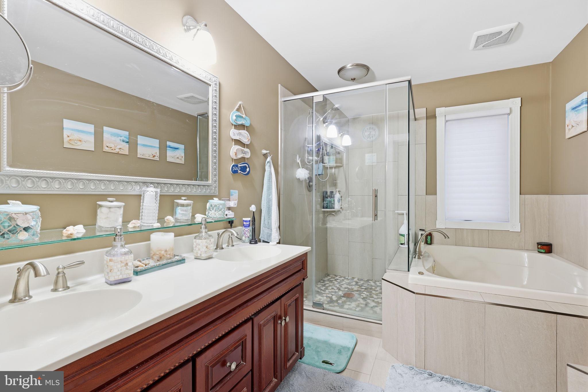 103 Greenvale Road Cherry Hill, NJ 08034 - Photo 26 of 36 a bathroom with a bathtub shower sink double and mirror