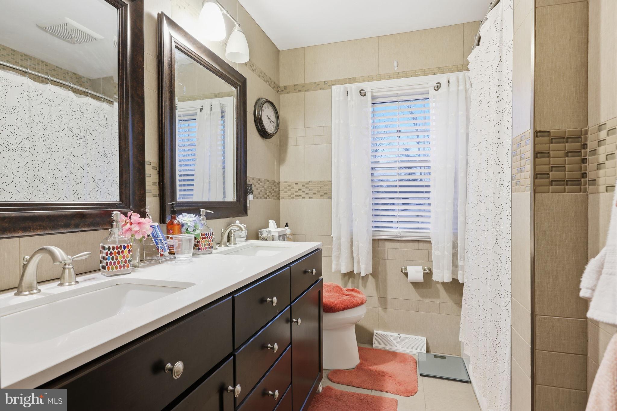 103 Greenvale Road Cherry Hill, NJ 08034 - Photo 30 of 36 a bathroom with a sink and a mirror