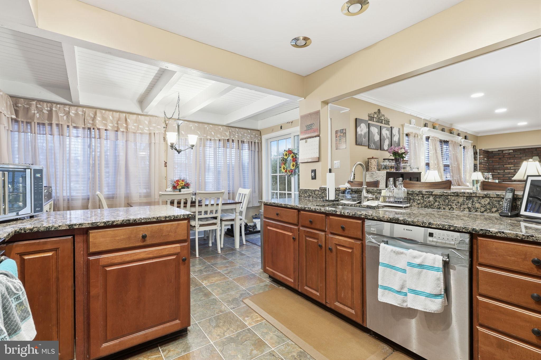 103 Greenvale Road Cherry Hill, NJ 08034 - Photo 10 of 36 a large kitchen with lots of counter space and a sink