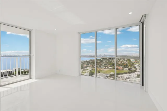 a view of an empty room and window