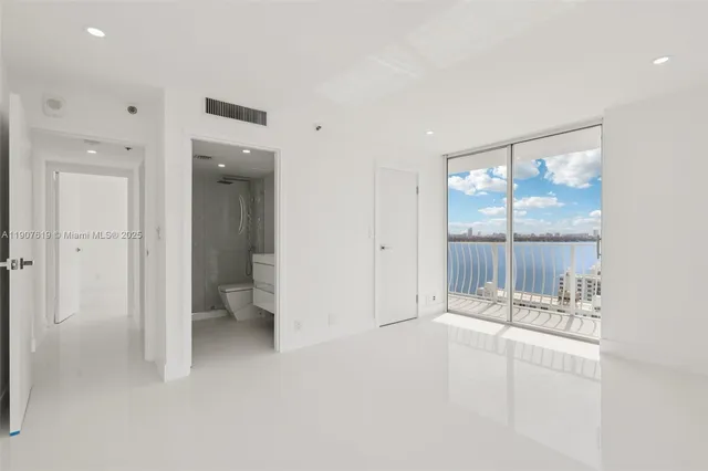 a bathroom with a tub and shower