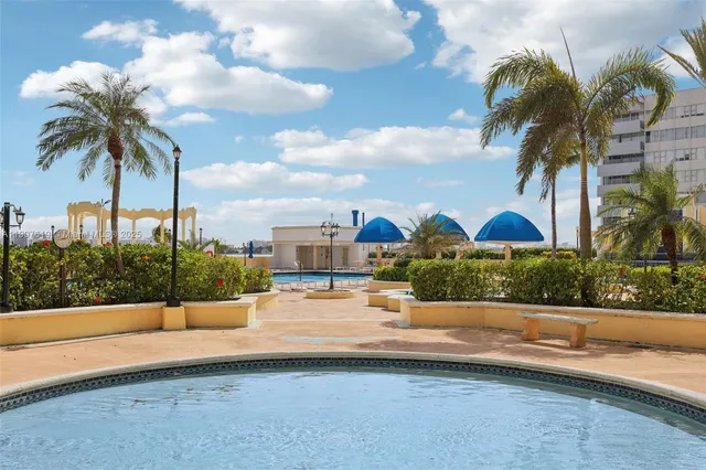 a living room with a table and chairs
