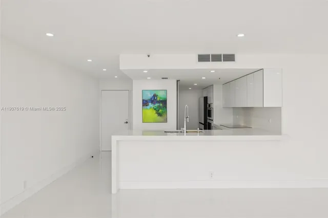 a view of a kitchen with a sink