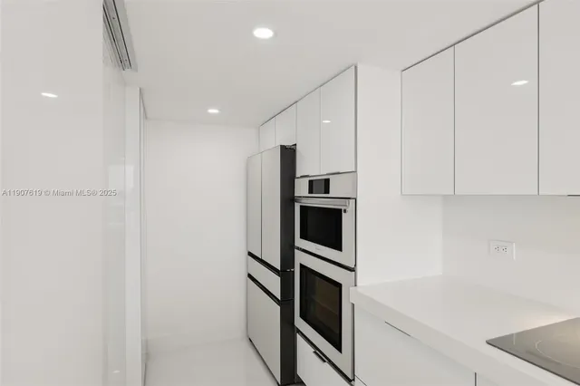 a kitchen with stainless steel appliances cabinets and a counter top