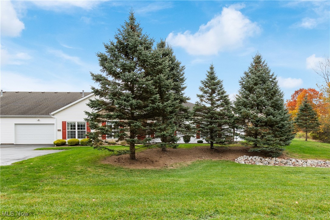 7030 Knight Avenue Northwest Canton, OH 44708 - Photo 26 of 26 View of front of house with a front lawn and a garage