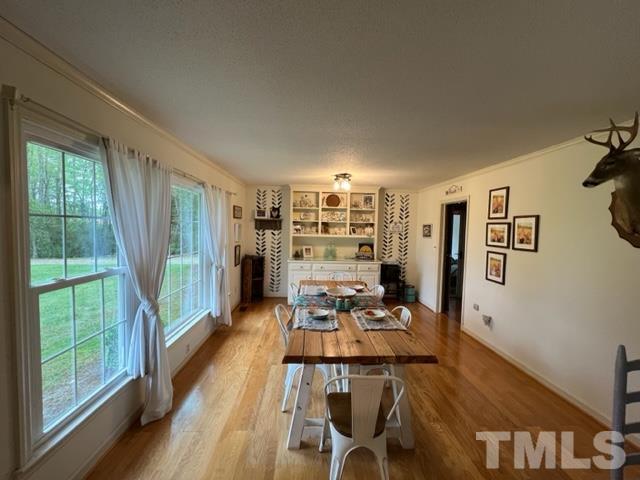 866 Lane Road Dunn, NC 28334 - Photo 11 of 41 a view of a dining room with furniture window and wooden floor