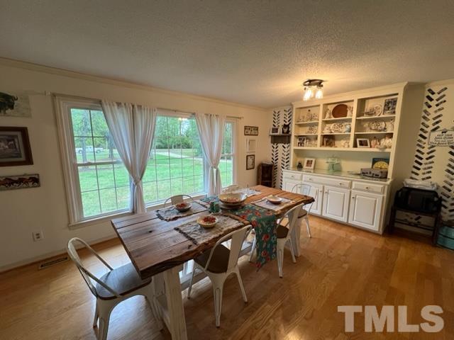 866 Lane Road Dunn, NC 28334 - Photo 12 of 41 a open kitchen with dining table and chairs