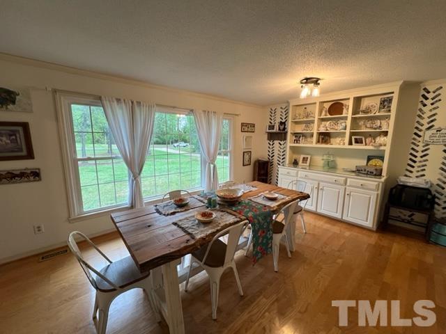 866 Lane Road Dunn, NC 28334 - Photo 13 of 41 a open kitchen with dining table and chairs