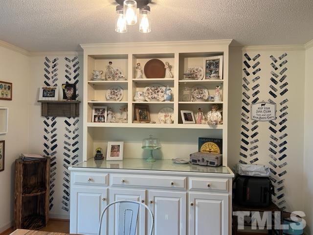 866 Lane Road Dunn, NC 28334 - Photo 17 of 41 a view of cabinets a bookshelf and a window