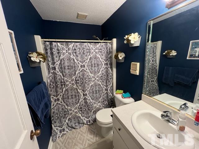 866 Lane Road Dunn, NC 28334 - Photo 18 of 41 a bathroom with a sink toilet and shower