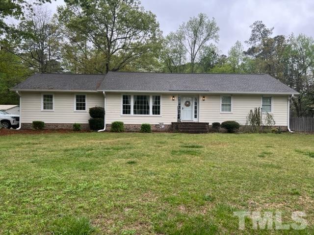 866 Lane Road Dunn, NC 28334 - Photo 2 of 41 a house view with a garden space