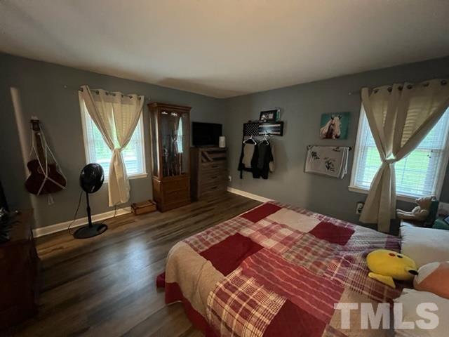 866 Lane Road Dunn, NC 28334 - Photo 25 of 41 a bedroom with a bed and wooden floor