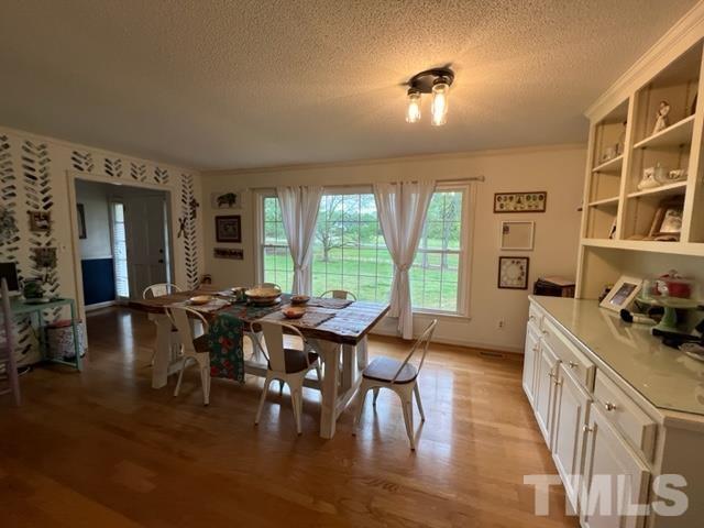 866 Lane Road Dunn, NC 28334 - Photo 27 of 41 a view of a dining room with furniture and wooden floor