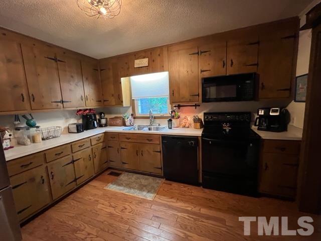 866 Lane Road Dunn, NC 28334 - Photo 29 of 41 a kitchen with a sink stove and refrigerator