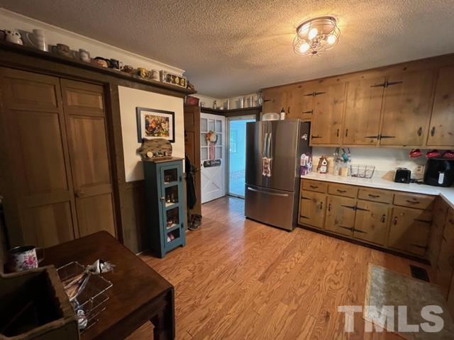 866 Lane Road Dunn, NC 28334 - Photo 30 of 41 a kitchen with stainless steel appliances a refrigerator and a stove