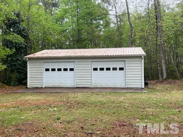 866 Lane Road Dunn, NC 28334 - Photo 33 of 41 a view of a house with a small yard and large tree