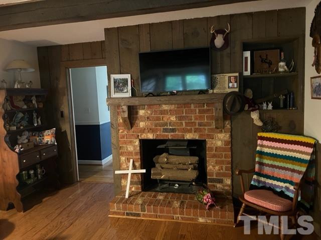 866 Lane Road Dunn, NC 28334 - Photo 5 of 41 a living room with furniture and a fireplace