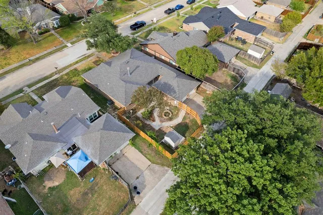an aerial view of residential house with outdoor space