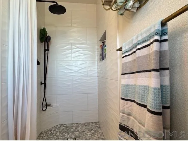 6522 Corte Montecito Carlsbad, CA 92009 - Photo 13 of 29 a bathroom with a shower