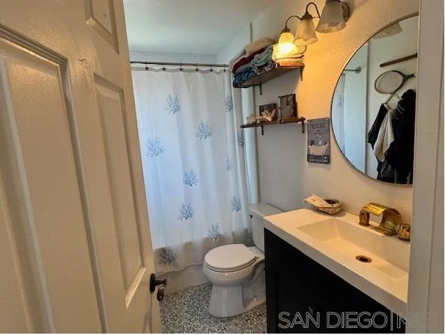 6522 Corte Montecito Carlsbad, CA 92009 - Photo 16 of 29 a bathroom with a sink toilet and shower