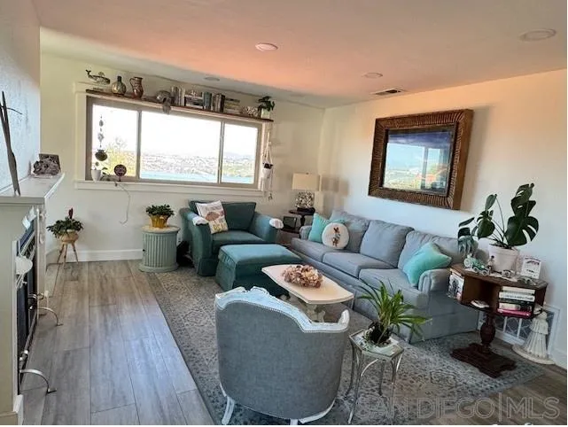 6522 Corte Montecito Carlsbad, CA 92009 - Photo 4 of 29 a living room with furniture and a large window