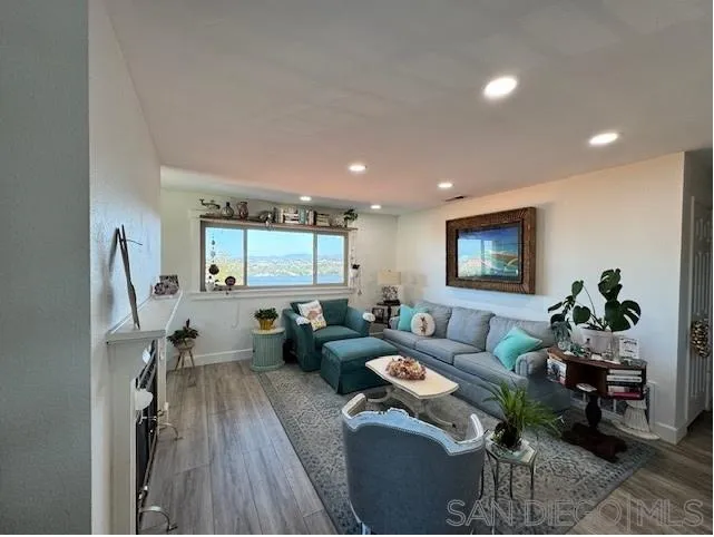 6522 Corte Montecito Carlsbad, CA 92009 - Photo 5 of 29 a living room with furniture and a wooden floor