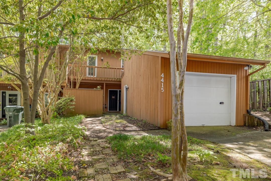 4415 Shadetree Court Raleigh, NC 27613 - Photo 1 of 23 a view of a house with backyard and tree