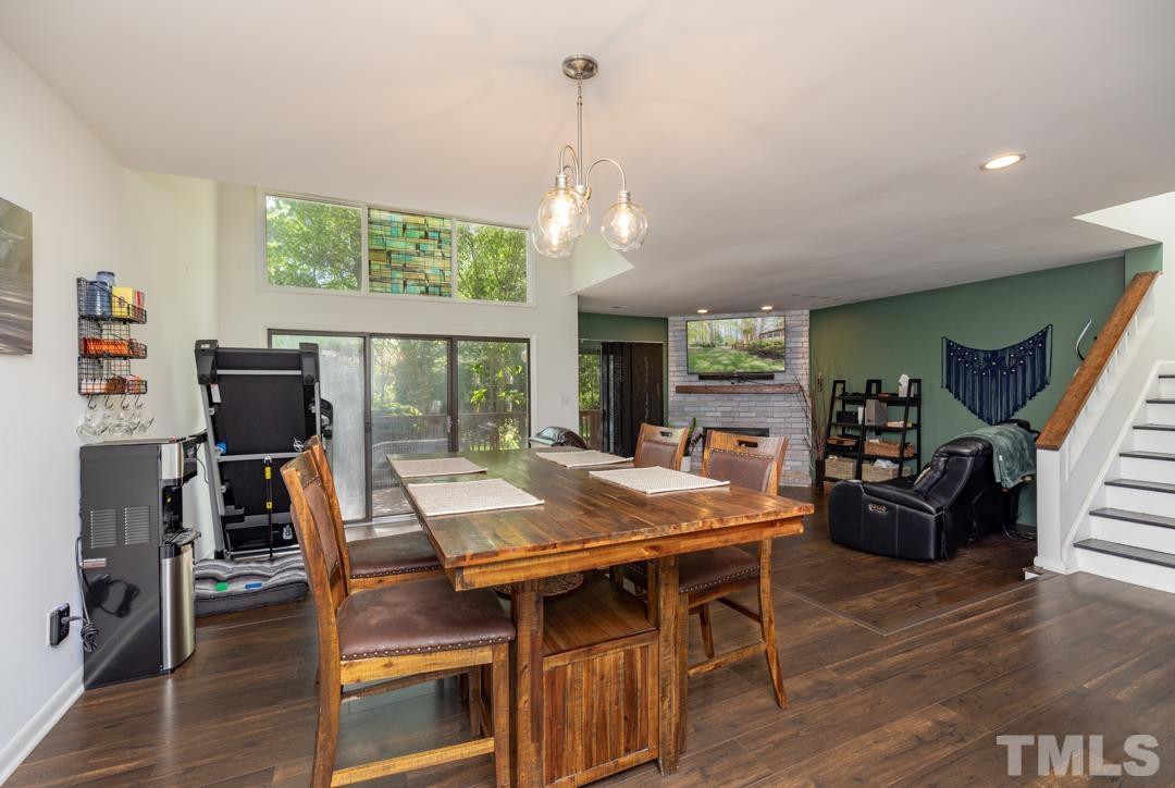4415 Shadetree Court Raleigh, NC 27613 - Photo 3 of 23 a view of a dining room with furniture window and wooden floor