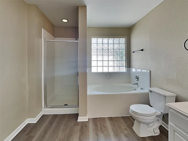 a bathroom with a toilet a sink and bathtub