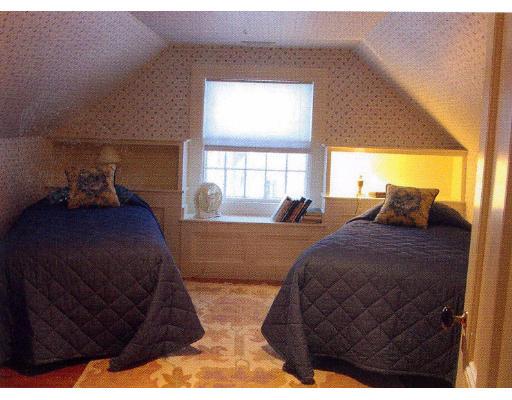 72 Abbott Road Wellesley, MA 02481 - Photo 17 of 18 a bed sitting in a bedroom next to a window