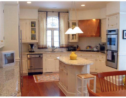 72 Abbott Road Wellesley, MA 02481 - Photo 7 of 18 a kitchen with stainless steel appliances granite countertop a sink a stove and a microwave