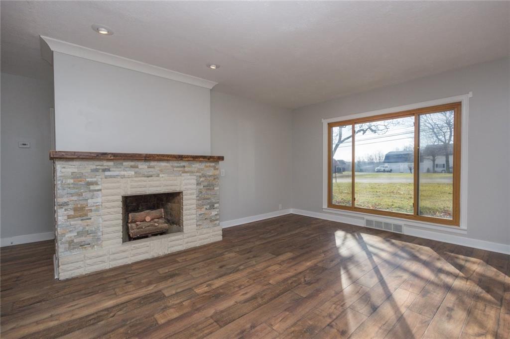 463 Center Grange Road Monaca, PA 15061 - Photo 11 of 21 Stone fireplace and large picture window. Lots of natural light!